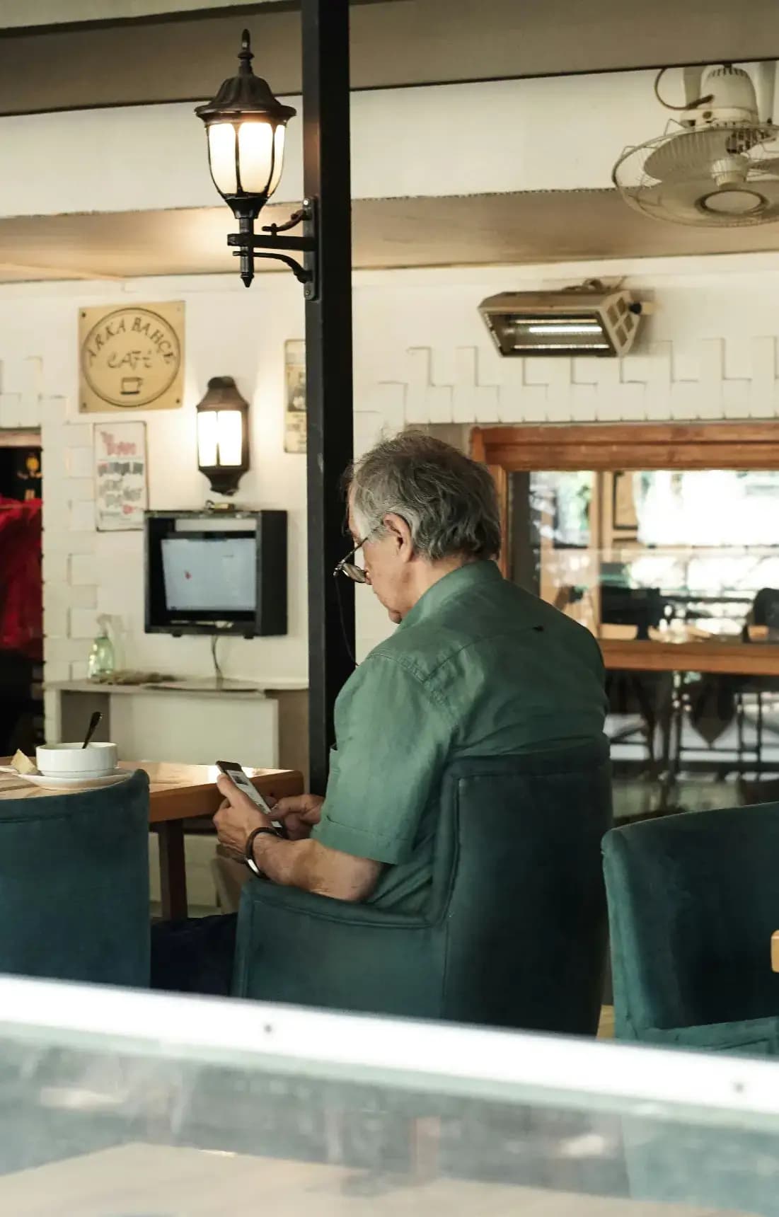 Restaurant owner checking a review alert on their phone
