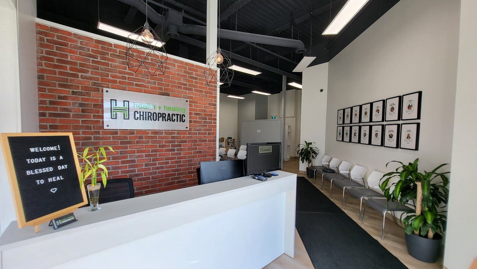 Health & Healing Family Chiropractic team reviewing patient feedback and Google reviews together at the front desk