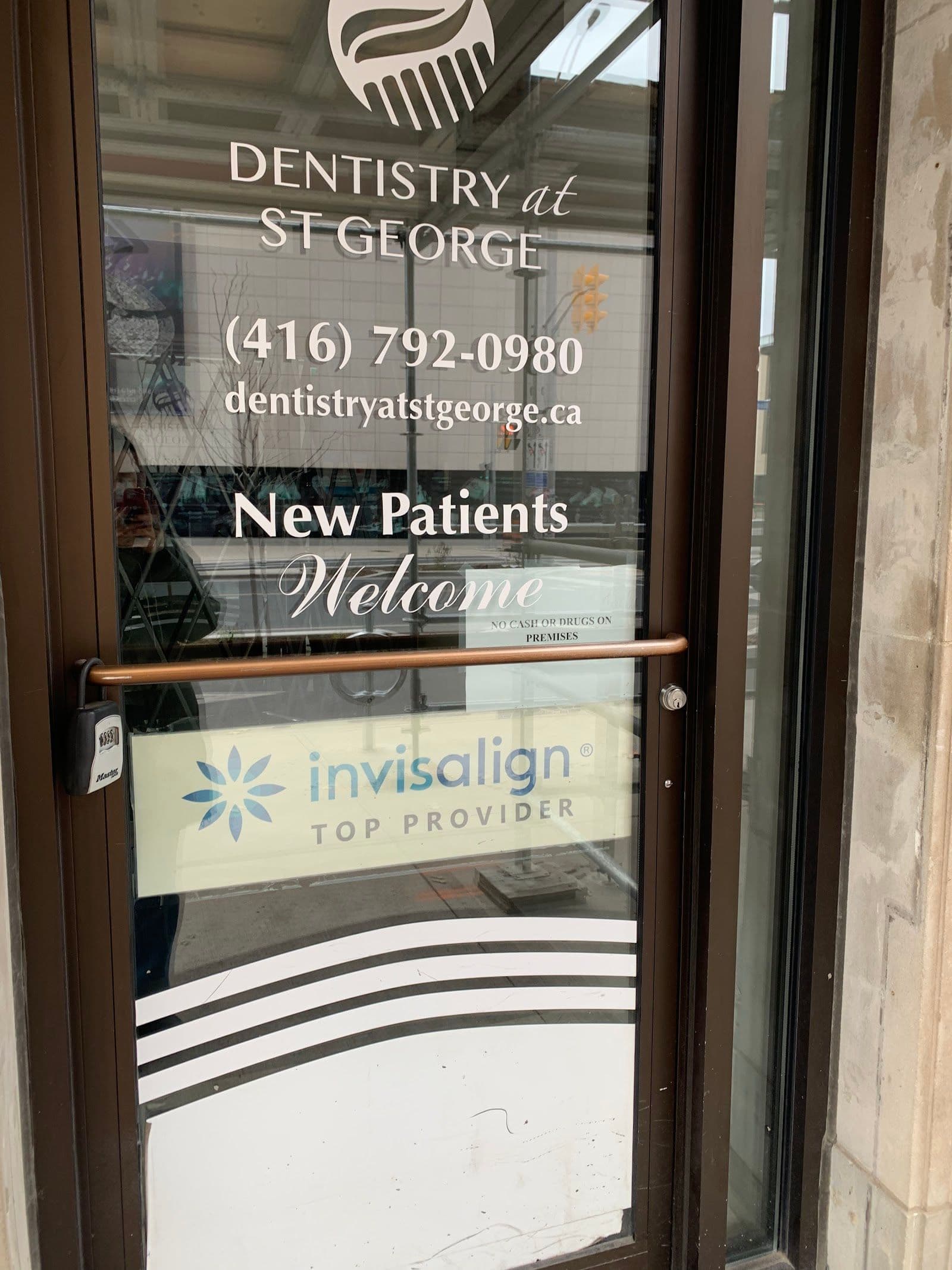 Dentistry at St George team reviewing patient feedback and Google reviews together at the front desk
