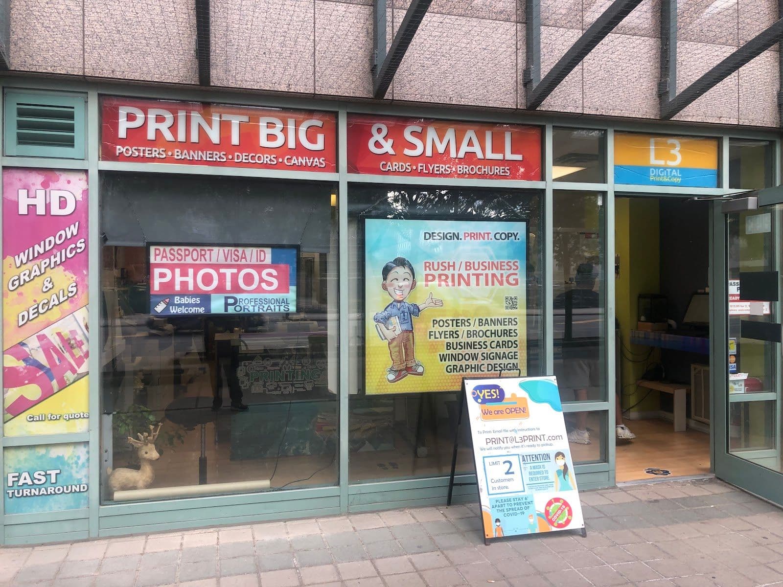 L3 Digital Print & Copy team reviewing customer feedback at their print shop counter