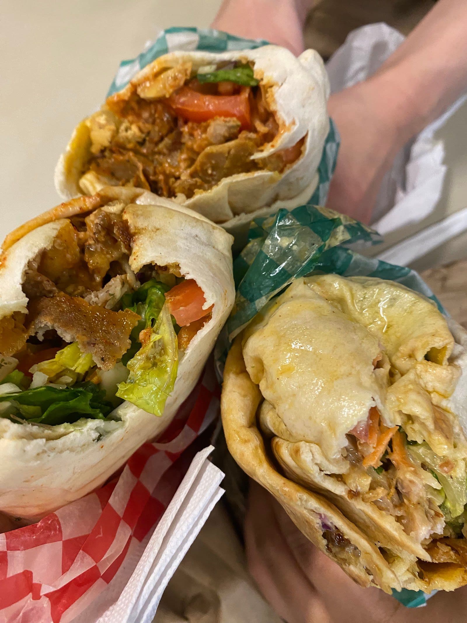 Big Pita owner and team reviewing guest feedback and Google reviews together at the counter