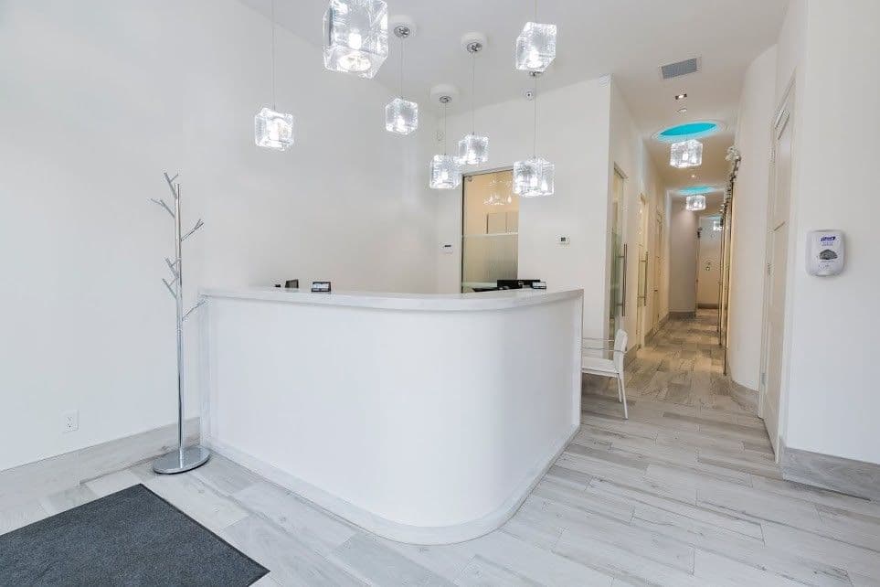 Dentistry on Queen Street West team reviewing patient feedback and Google reviews together at the front desk