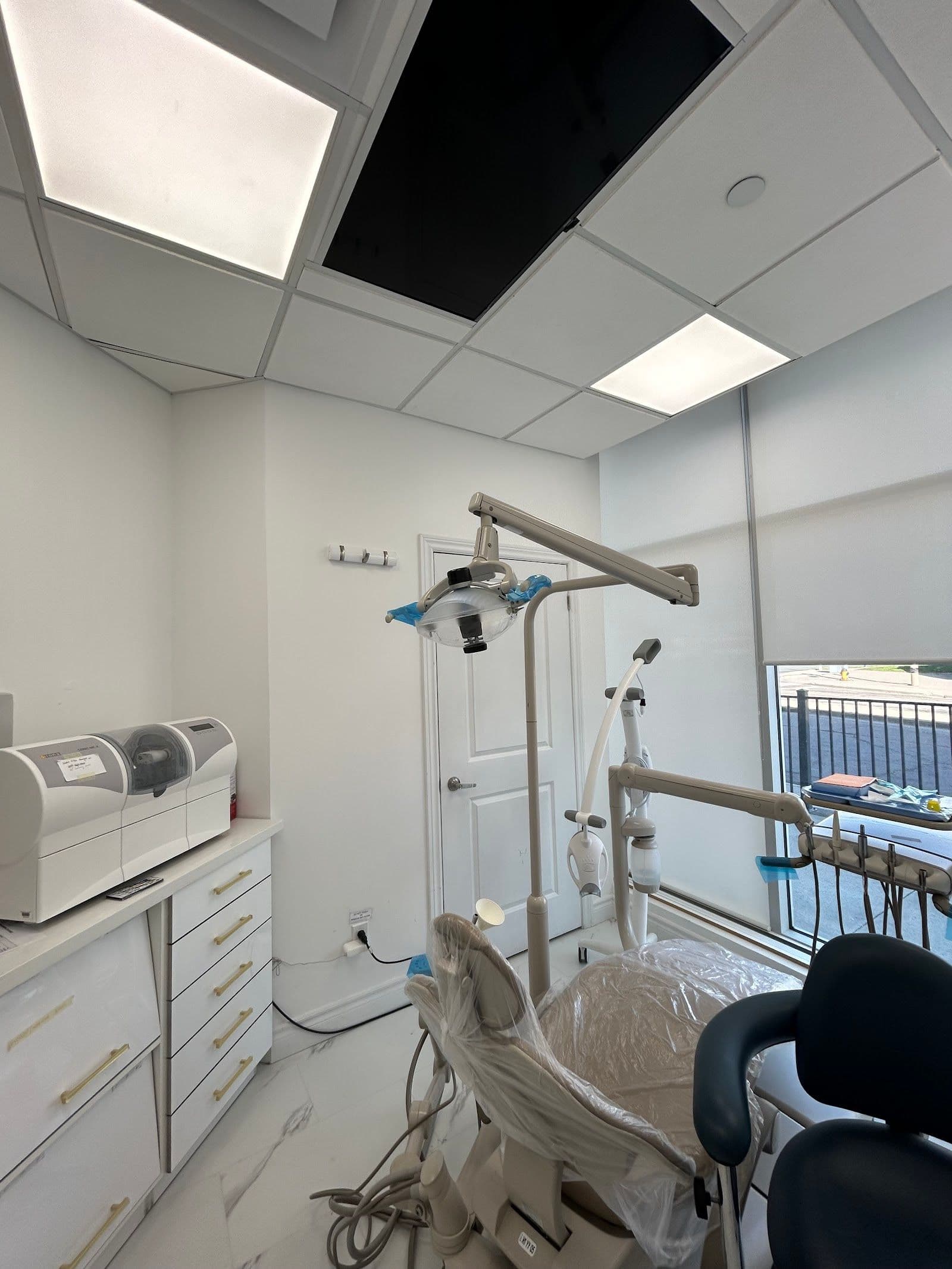 Markham Gateway Dentistry dental team reviewing patient feedback together at their front desk