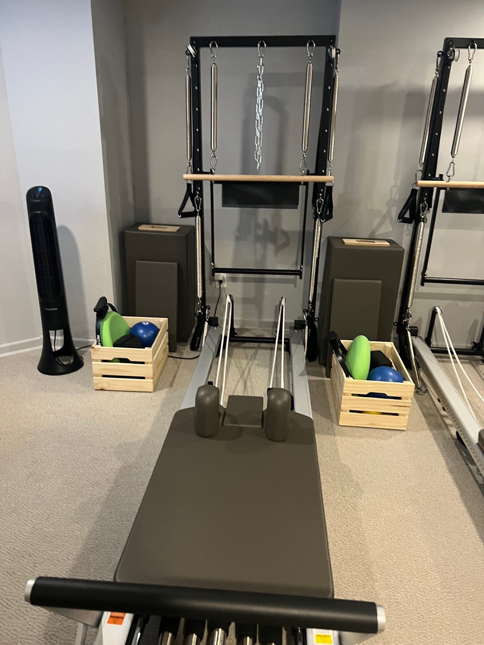 My Pilates Studio owner and instructor reviewing member feedback together at the front desk of the studio