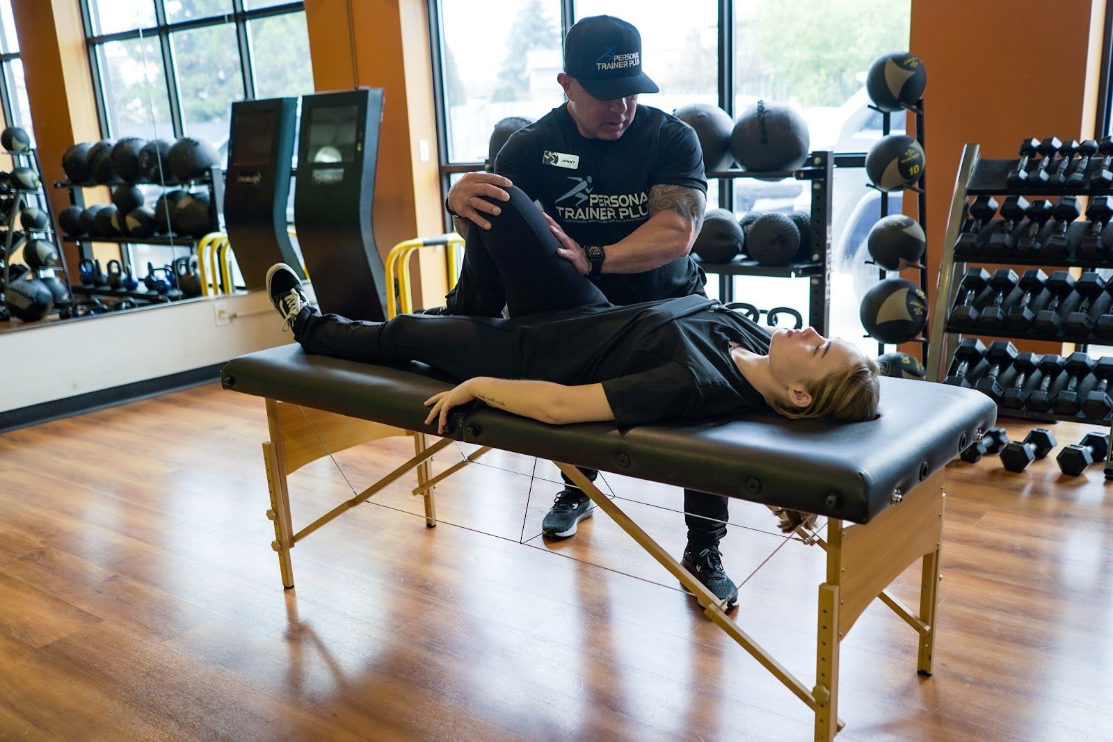 Personal trainer checking Google reviews on her phone at the studio