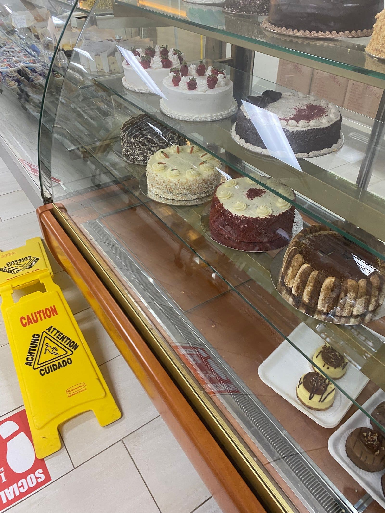 Owner and team at La Farina Bakery reviewing Google guest feedback together at the counter