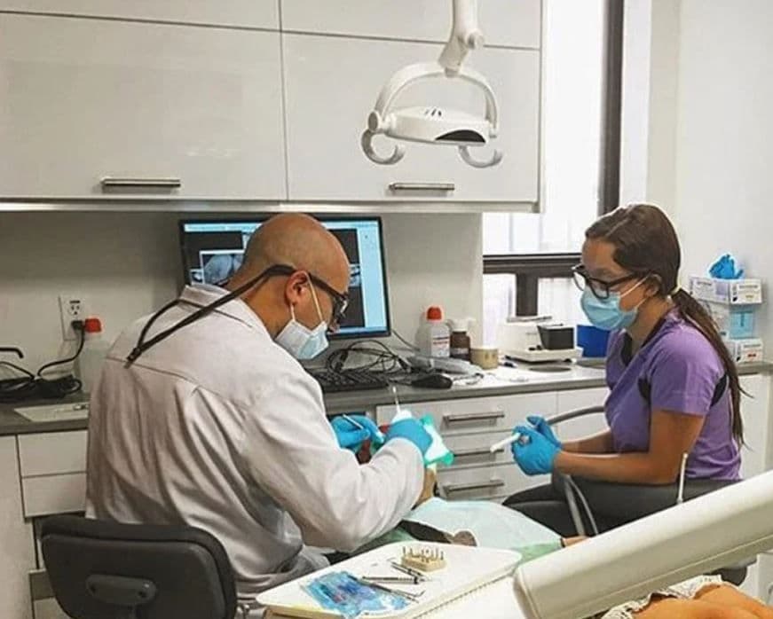 Bond Street Dental team reviewing patient feedback on a dashboard, discussing Google reviews and visit experience together