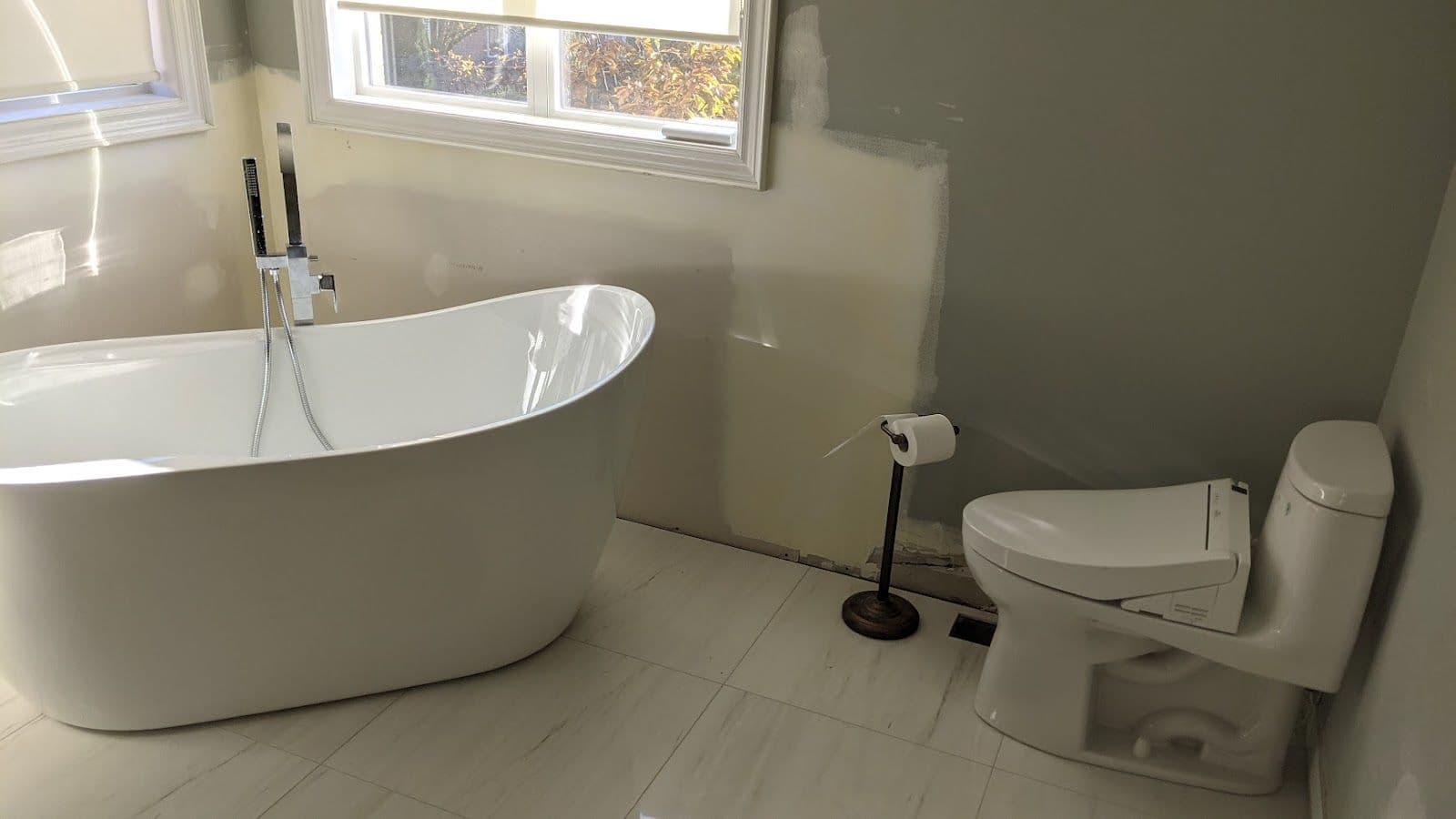 Emergency Plumbing Toronto owner reviewing guest feedback and Google reviews on a dashboard after a service call