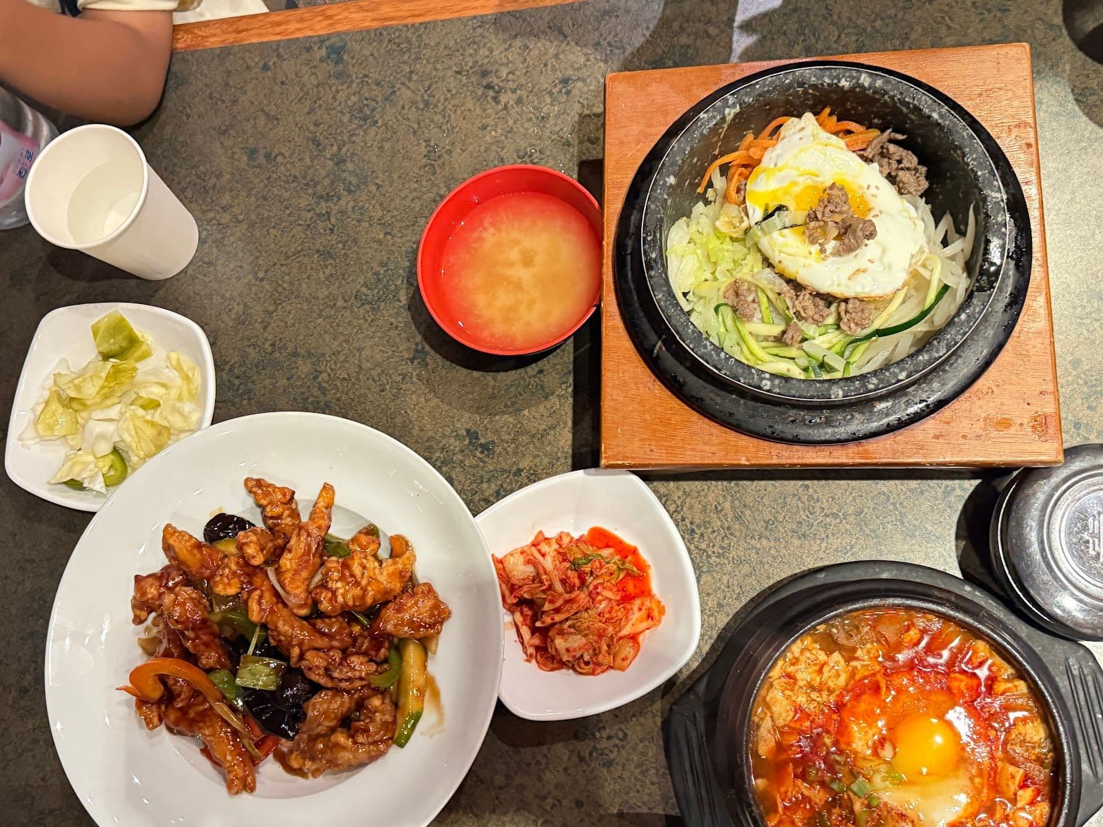 Restaurant team reviewing guest feedback at Young Garden - AYCE Korean BBQ & Cuisine