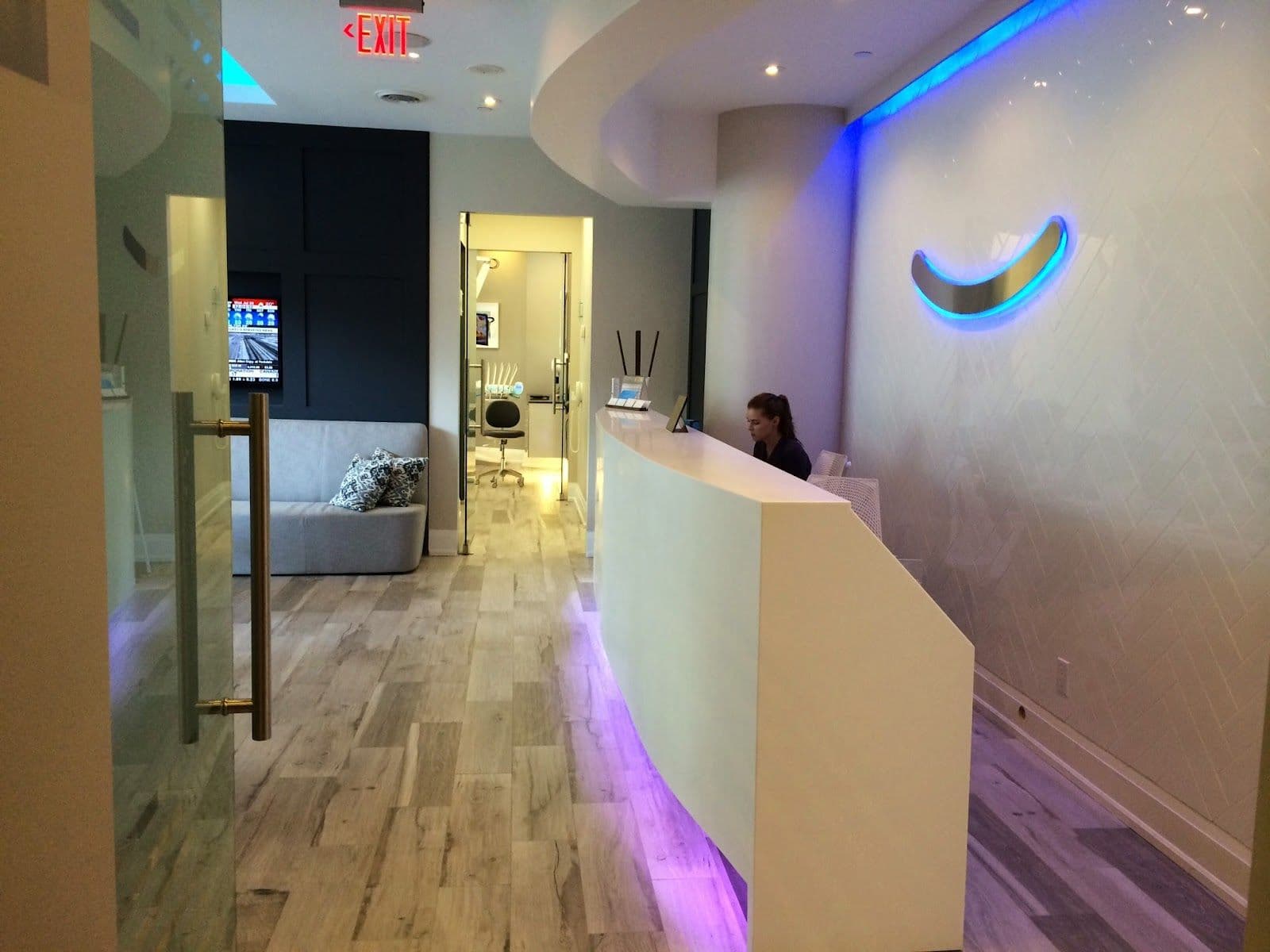 Harbour Dental Centre team reviewing patient feedback and Google reviews together at the front desk