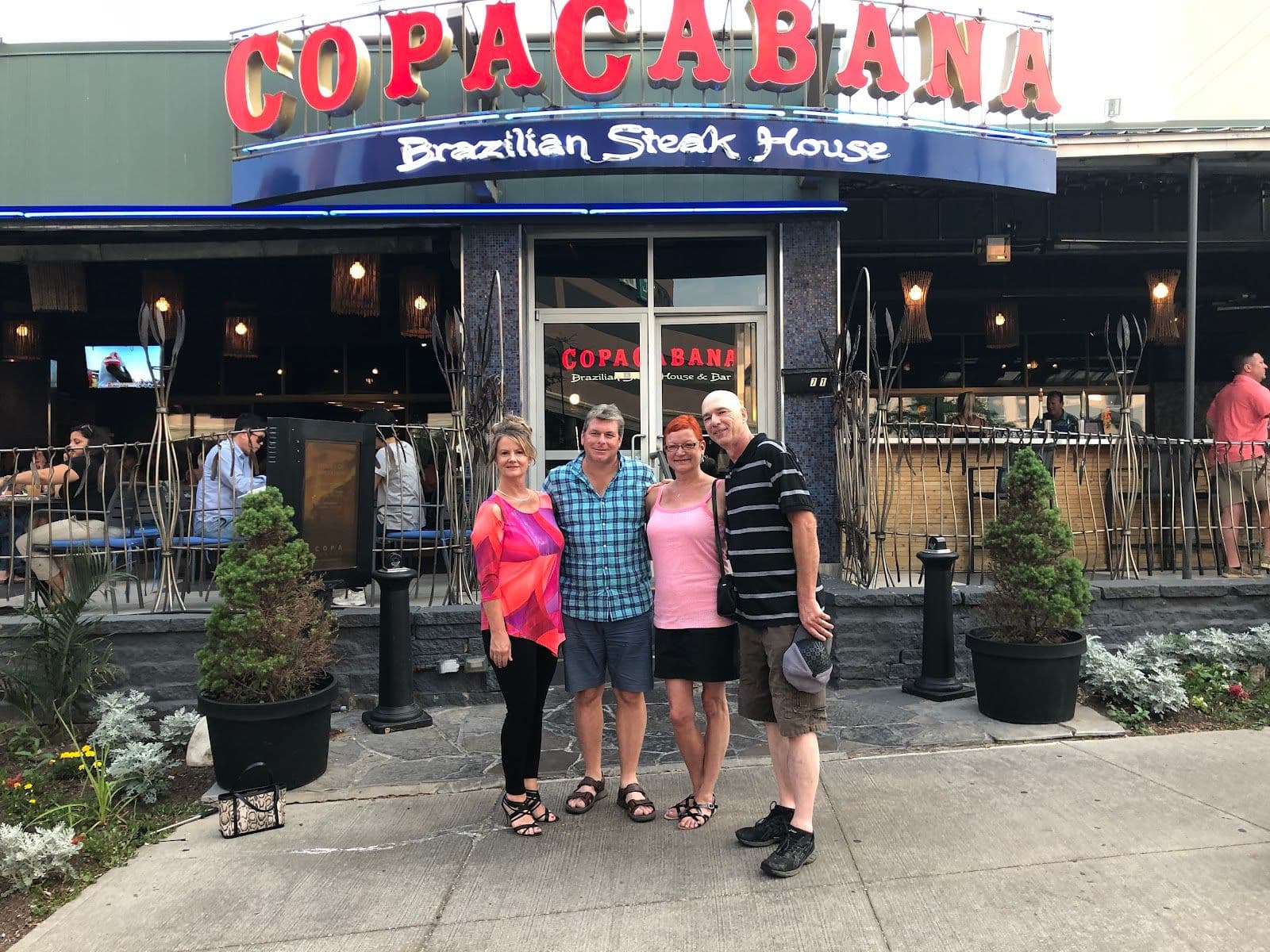 Restaurant team reviewing guest feedback at Copacabana Brazilian Steakhouse - Niagara