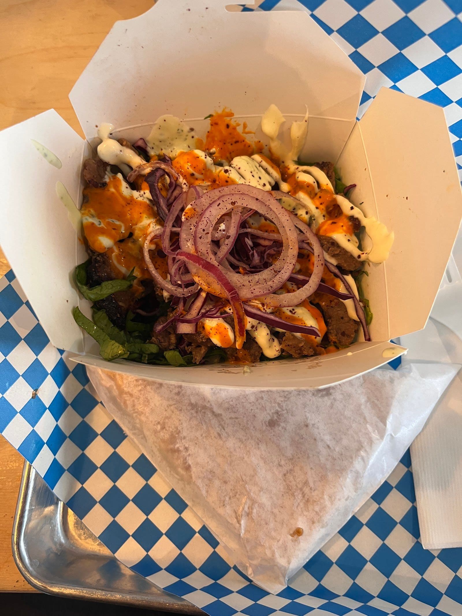 Otto's Berlin Döner team reviewing guest feedback on a tablet at the counter
