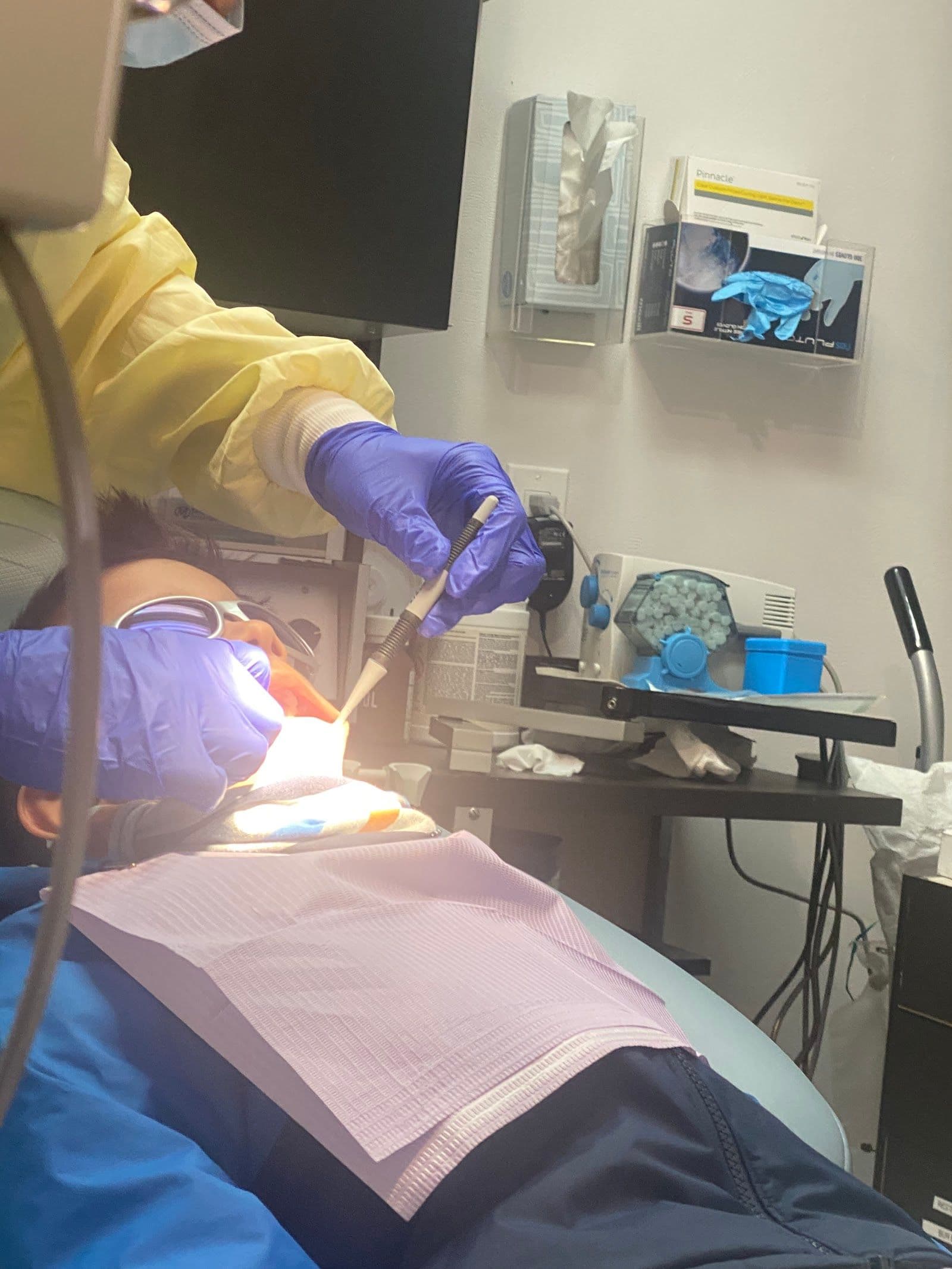 Danforth Village Dental Care - East York team reviewing patient feedback on a dashboard at the front desk