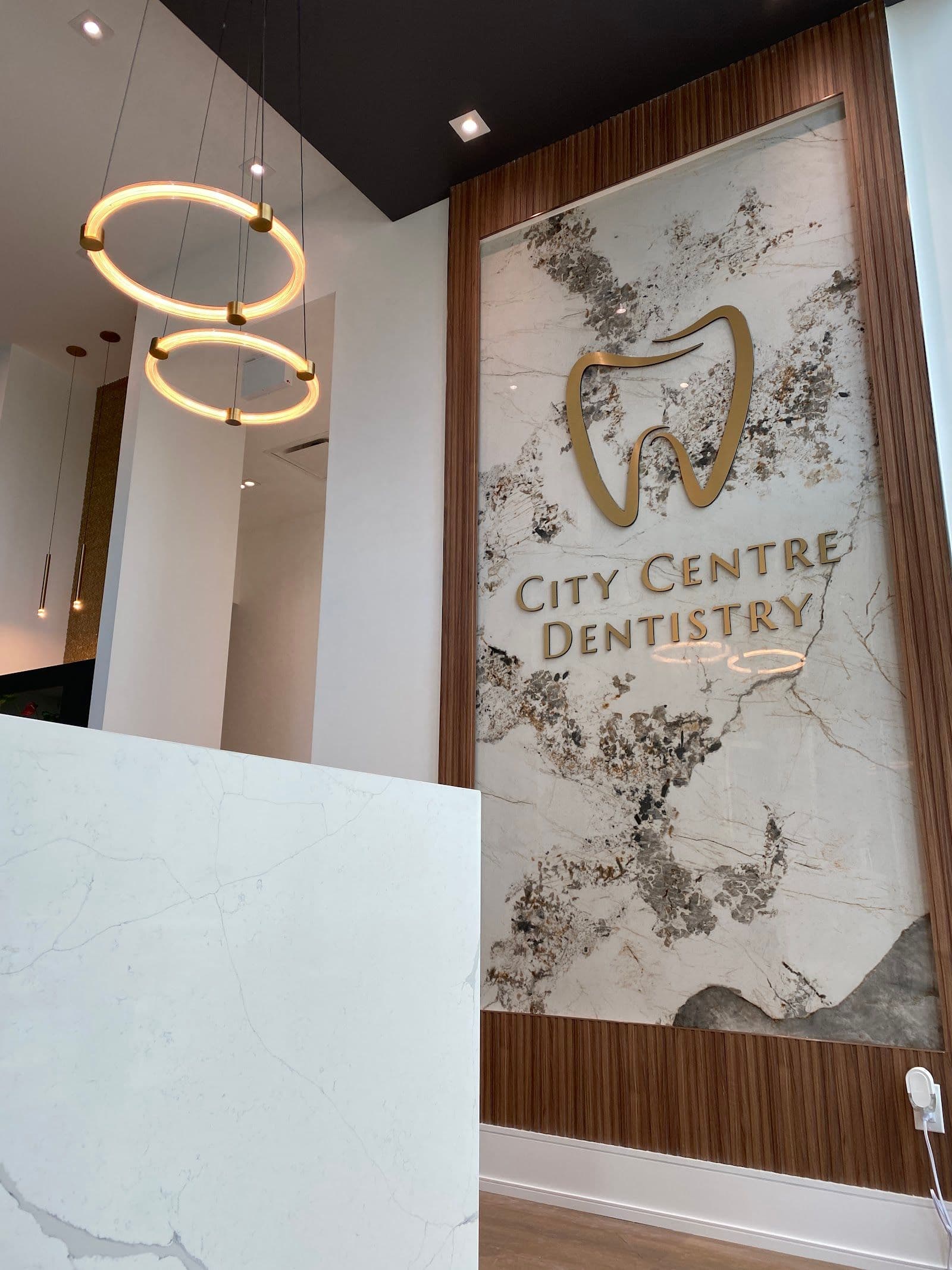 City Centre Dentistry team reviewing patient feedback on a dashboard, with dental clinic setting in the background