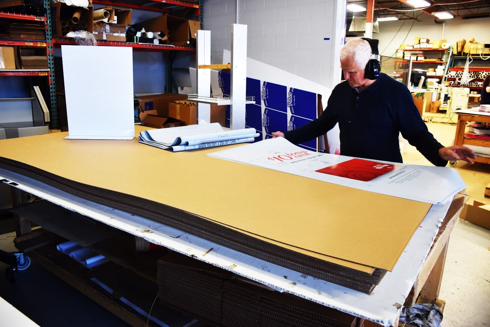 Print shop owner and team member reviewing Google feedback and customer comments together at Eprintz Print Shop in Kitchener