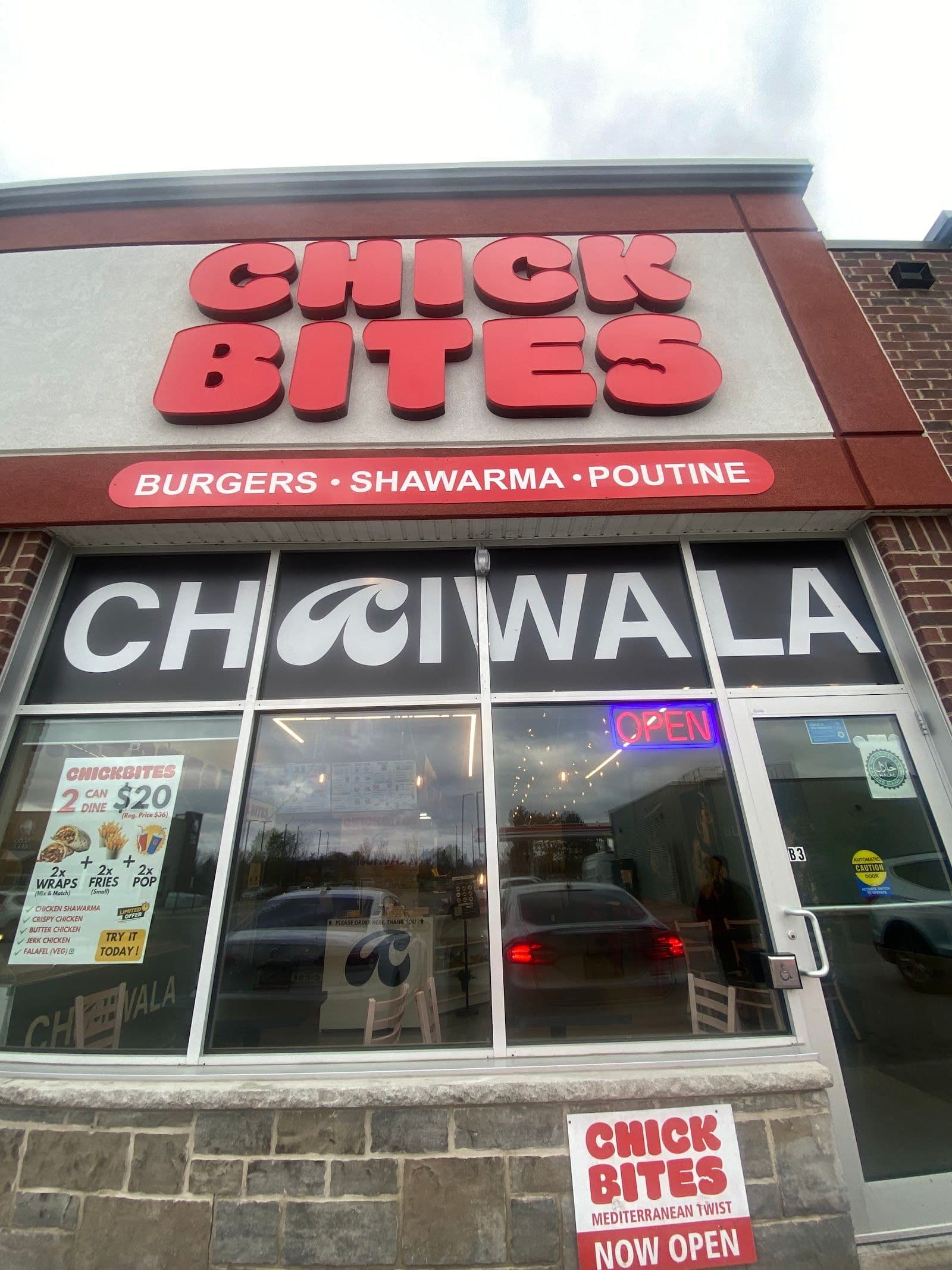 Restaurant team at Chaiwala Company Kitchener reviewing guest feedback and Google reviews together on a tablet