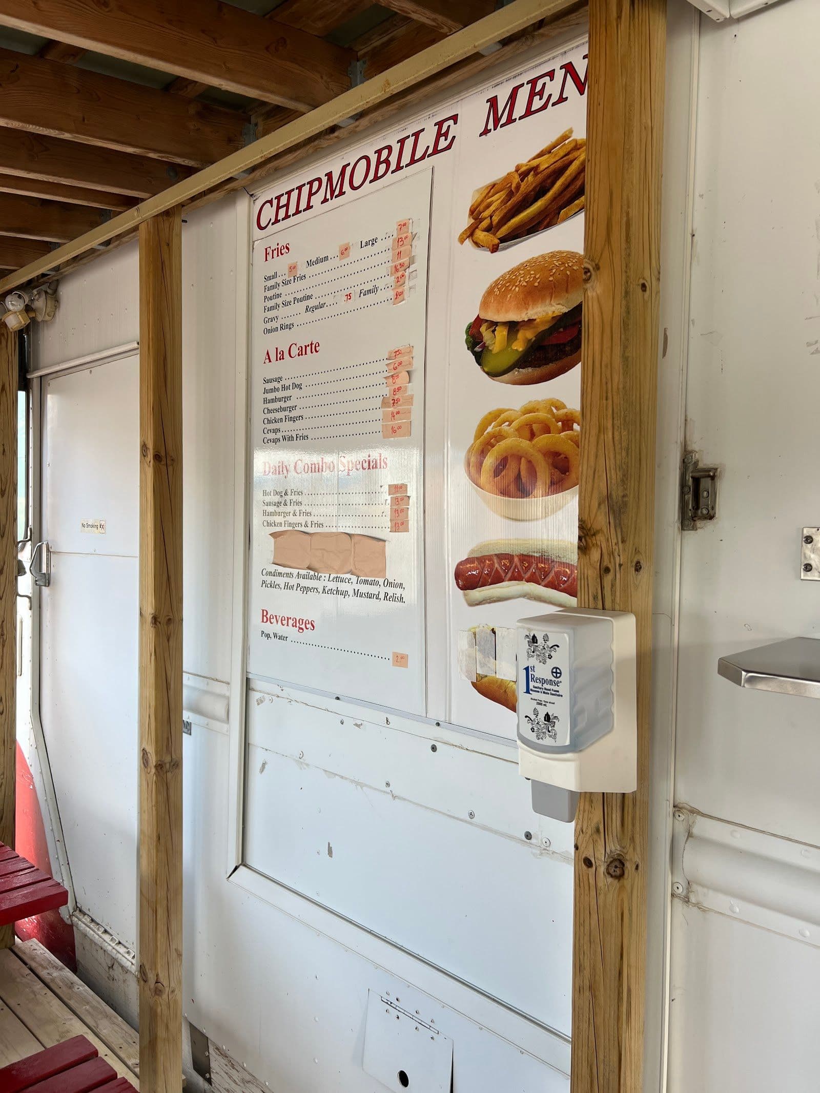 Owner and team at Niagara Lunch Truck reviewing guest feedback on a tablet near the outdoor patio