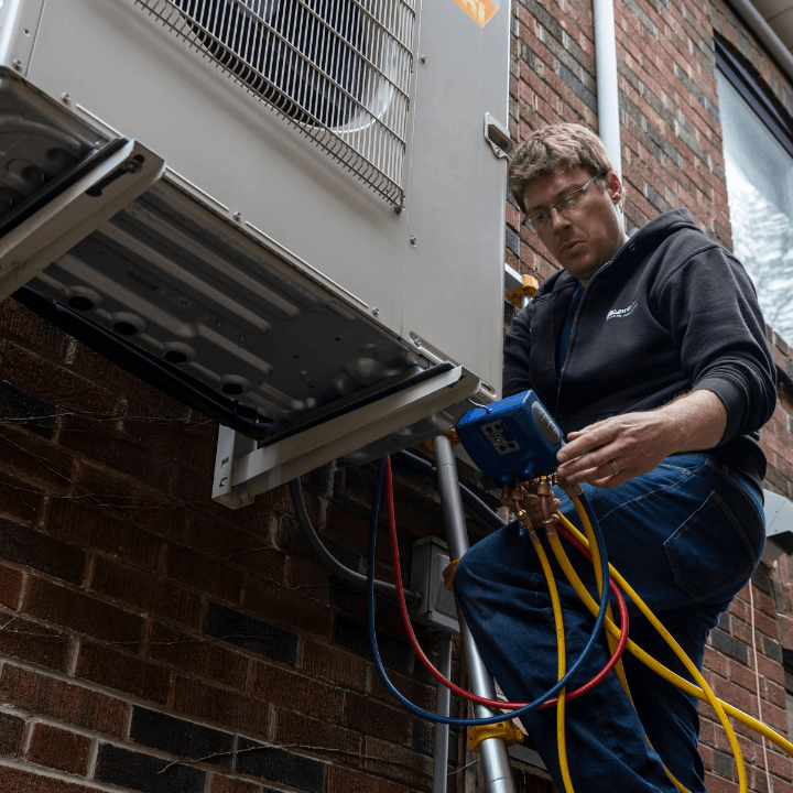 Laird and Son Heating and Air Conditioning team reviewing customer feedback and Google reviews on a dashboard