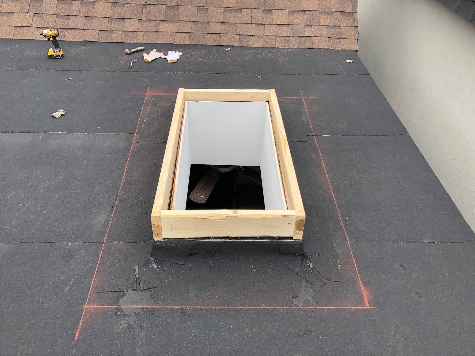 All Roofing owner reviewing customer feedback and Google reviews on a mobile dashboard after a roofing job