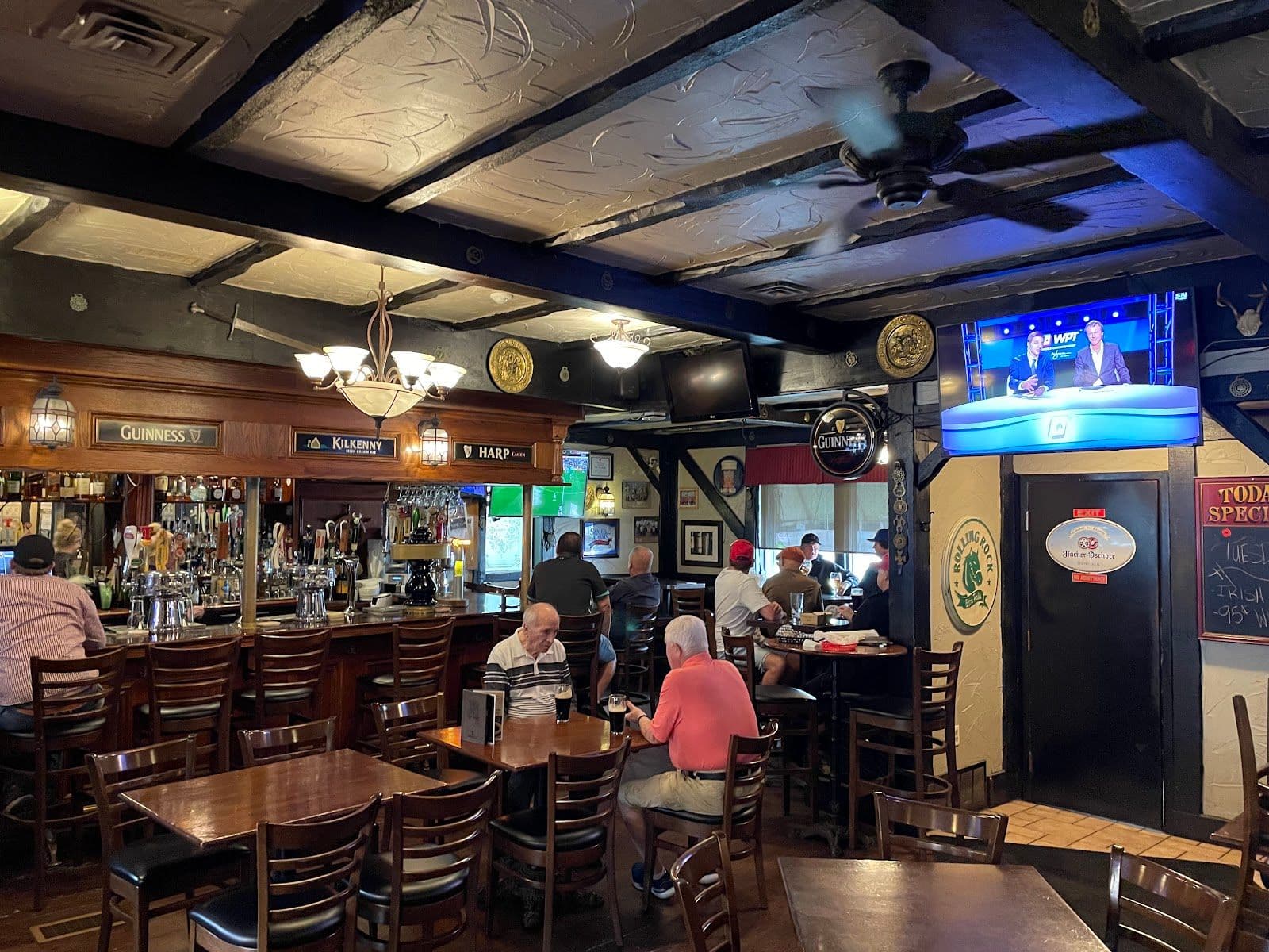 Ivy Arms team reviewing guest feedback and Google reviews together at the bar