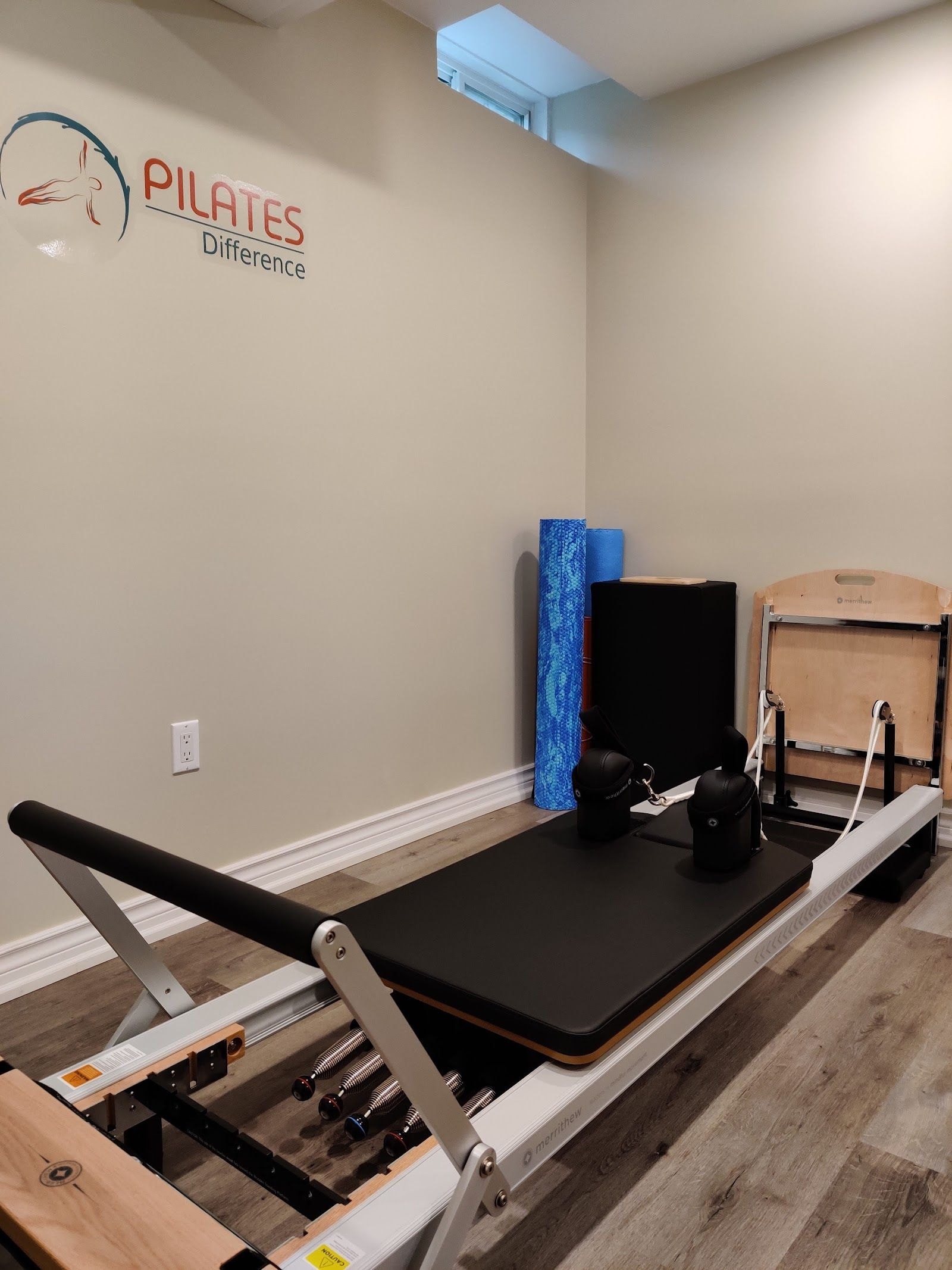 Personal trainer checking Google reviews on her phone at the studio