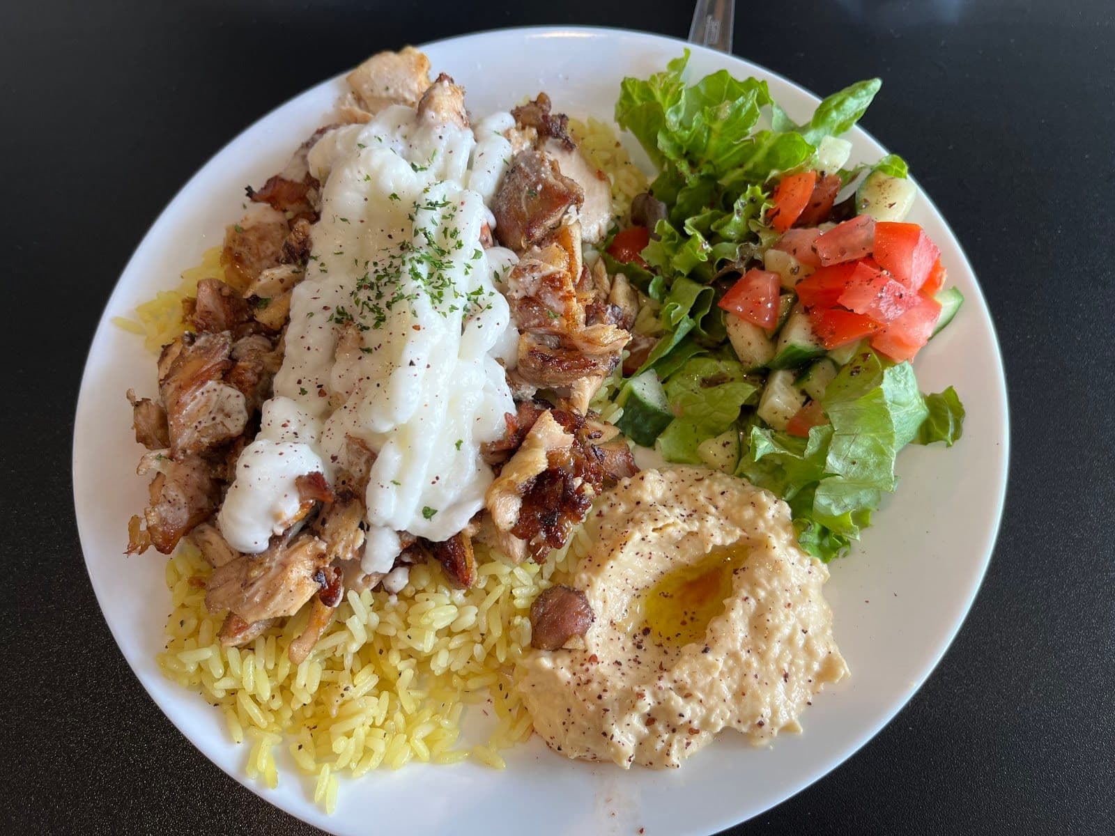 Restaurant manager and team member reviewing Google guest feedback together at Palms Shawarma & Mediterranean Cafe in Niagara Falls