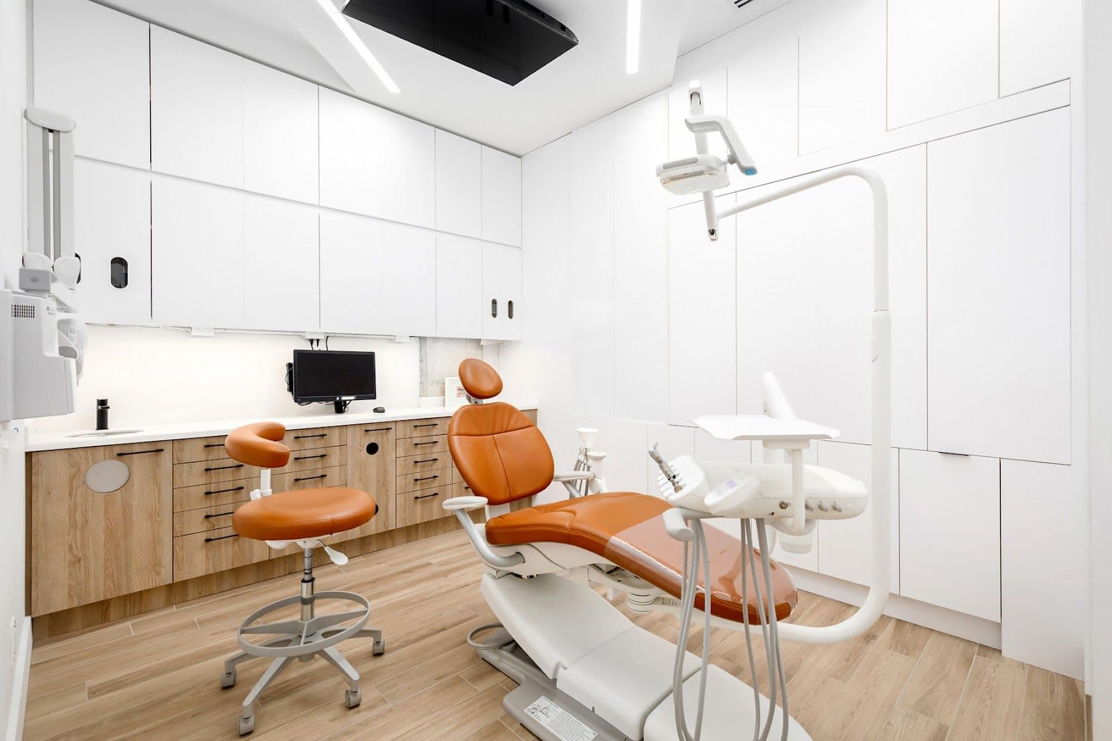 Dent Leslieville dental team reviewing patient feedback together at the front desk