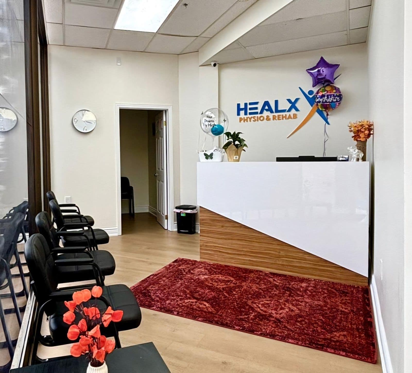 HealX Physio & Rehab clinic team reviewing patient feedback and Google reviews together at their Woodbridge location