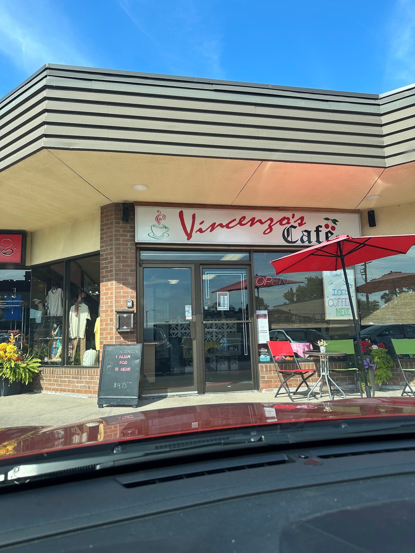 Restaurant team reviewing guest feedback at Vincenzo's Cafe