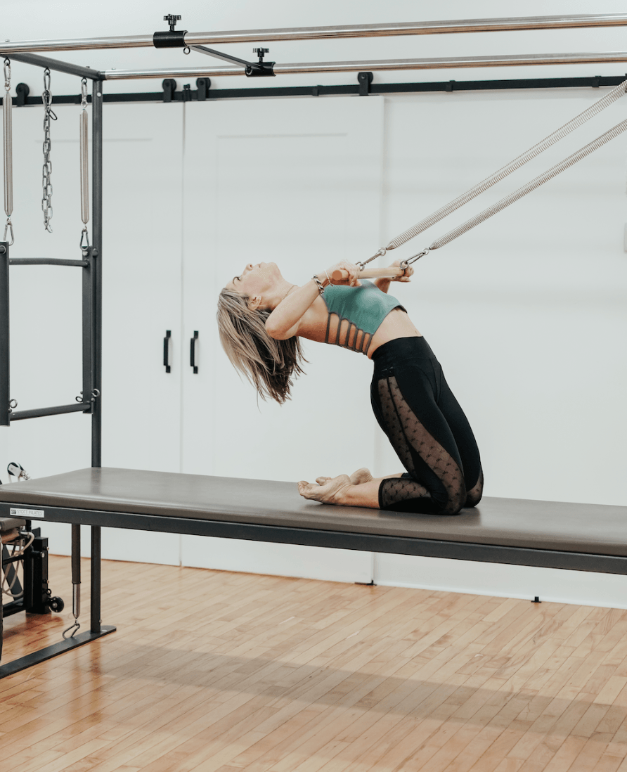 Personal trainer checking Google reviews on her phone at the studio