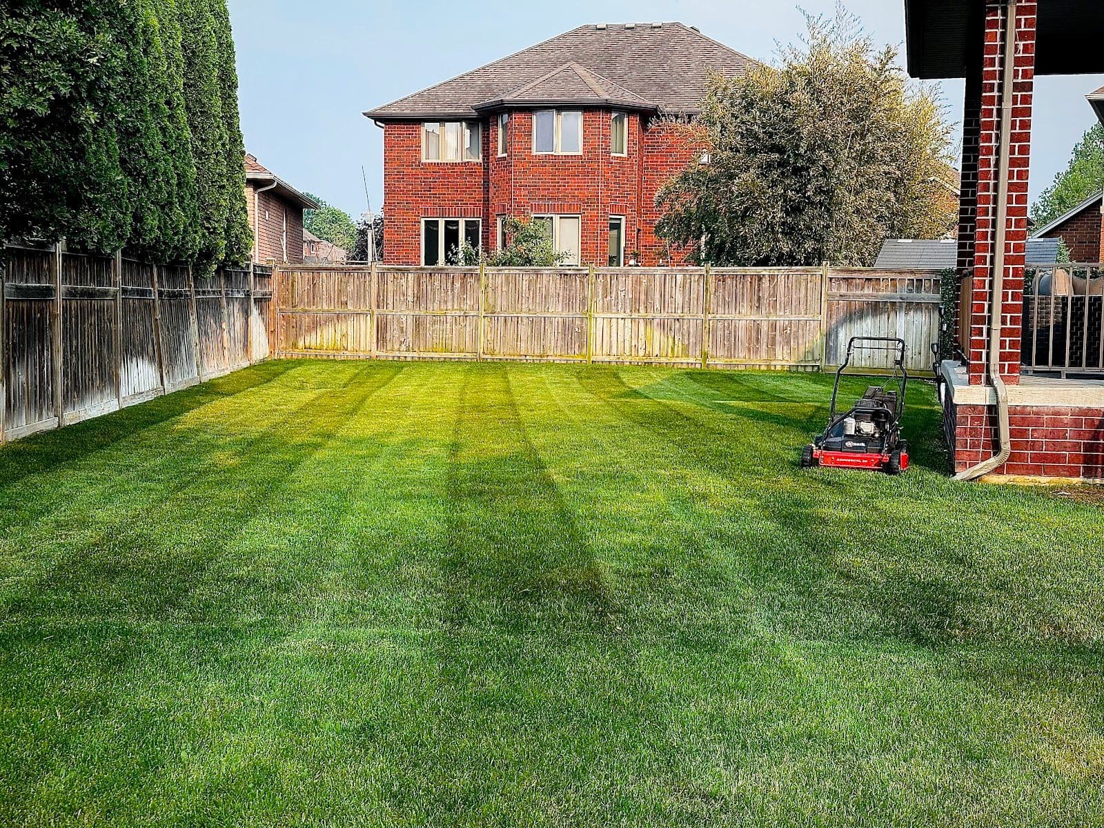 A Cut Above owner reviewing lawn care customer feedback on a tablet after a day of service visits