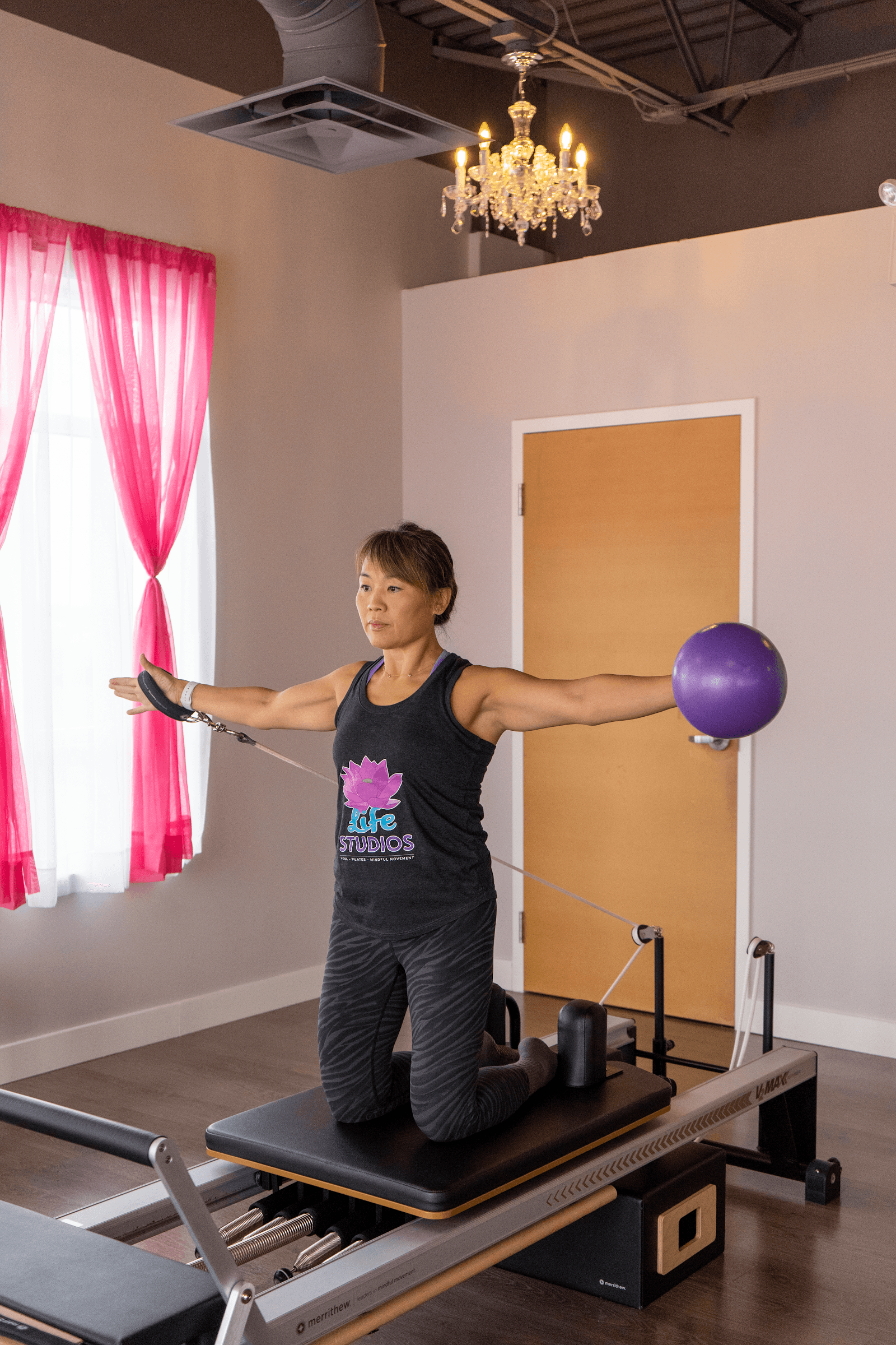 Life Yoga and Reformer Pilates Studio Milton team reviewing member feedback and Google reviews together at the front desk