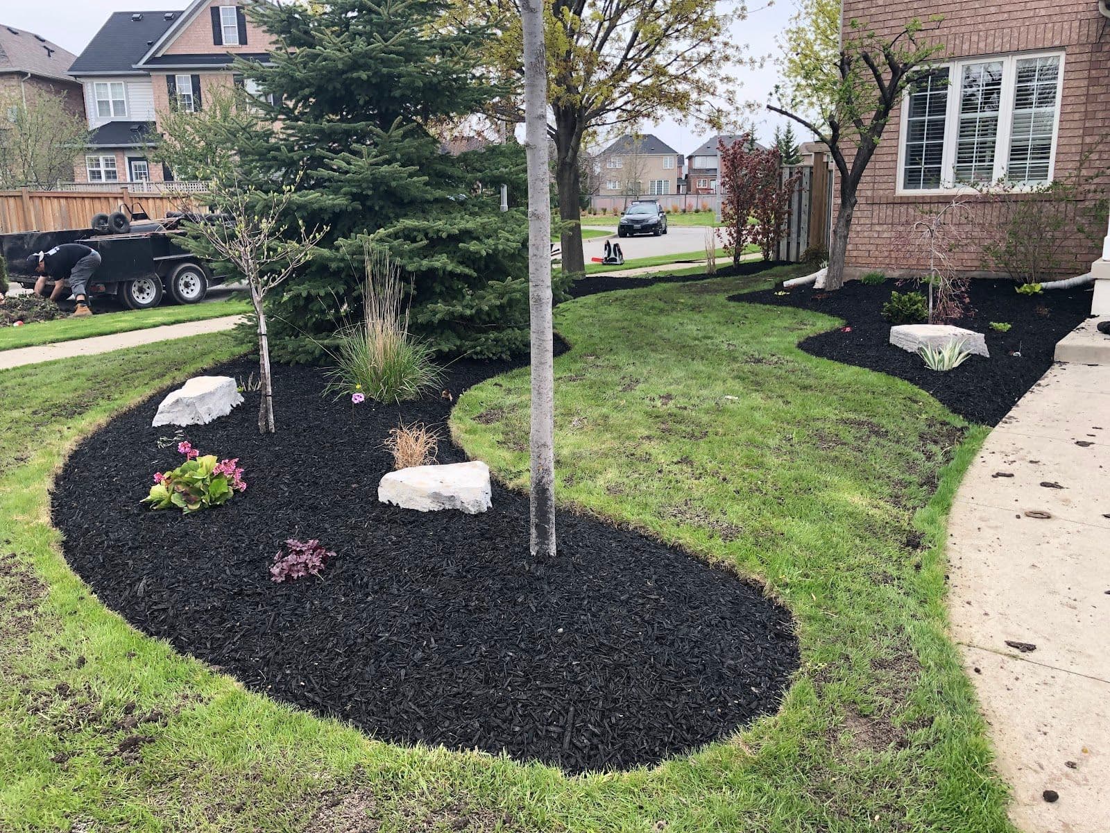 B&B Lawn and Garden owner reviewing customer feedback and Google reviews on a dashboard after a lawn and garden project