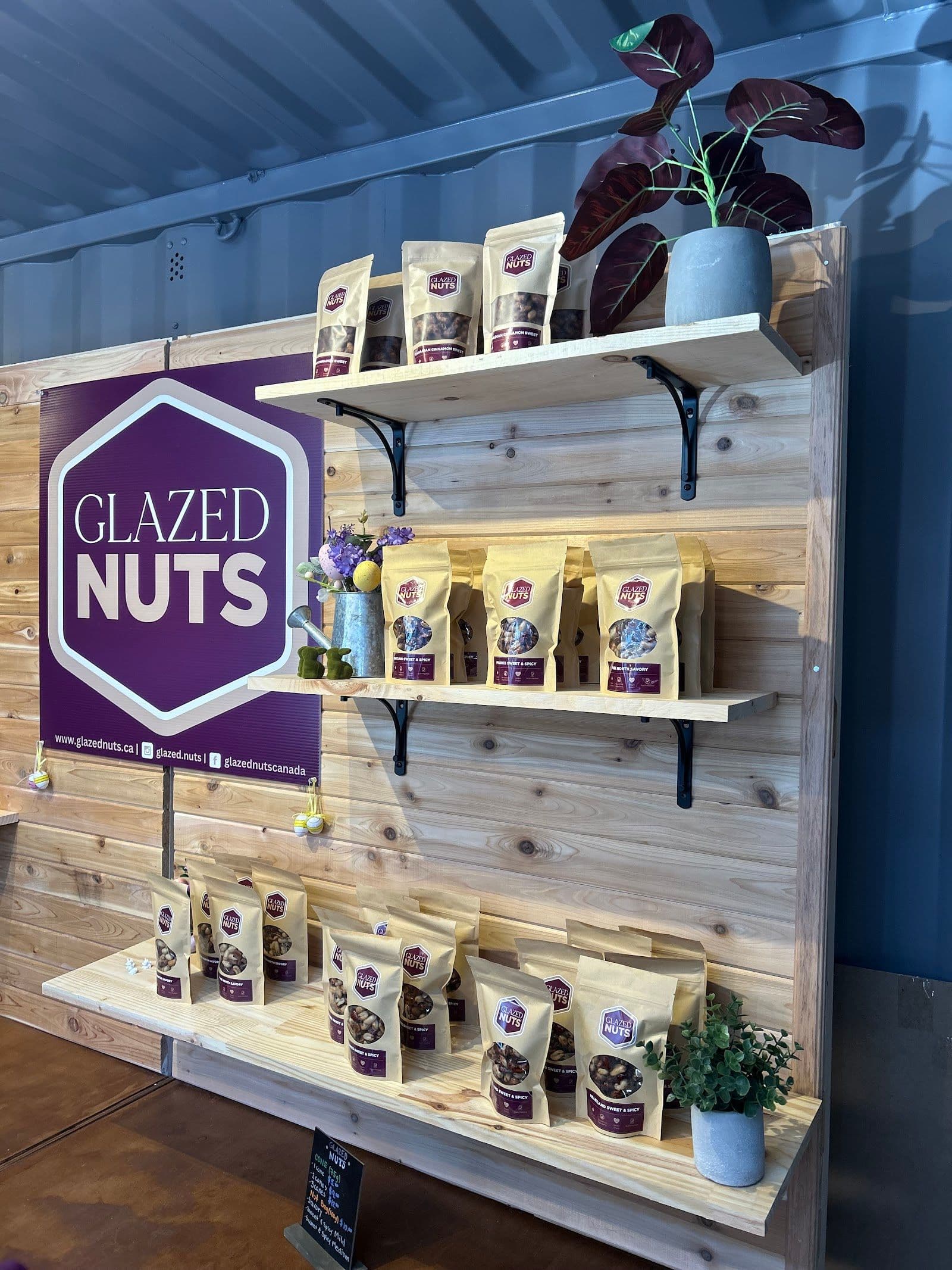Glazed Nuts team reviewing guest feedback and Google reviews together at their market booth or packing station