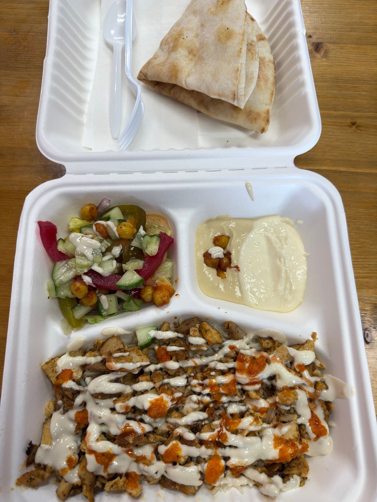 Restaurant team reviewing guest feedback at Hijabeez Shawarma Wraps & Platters.