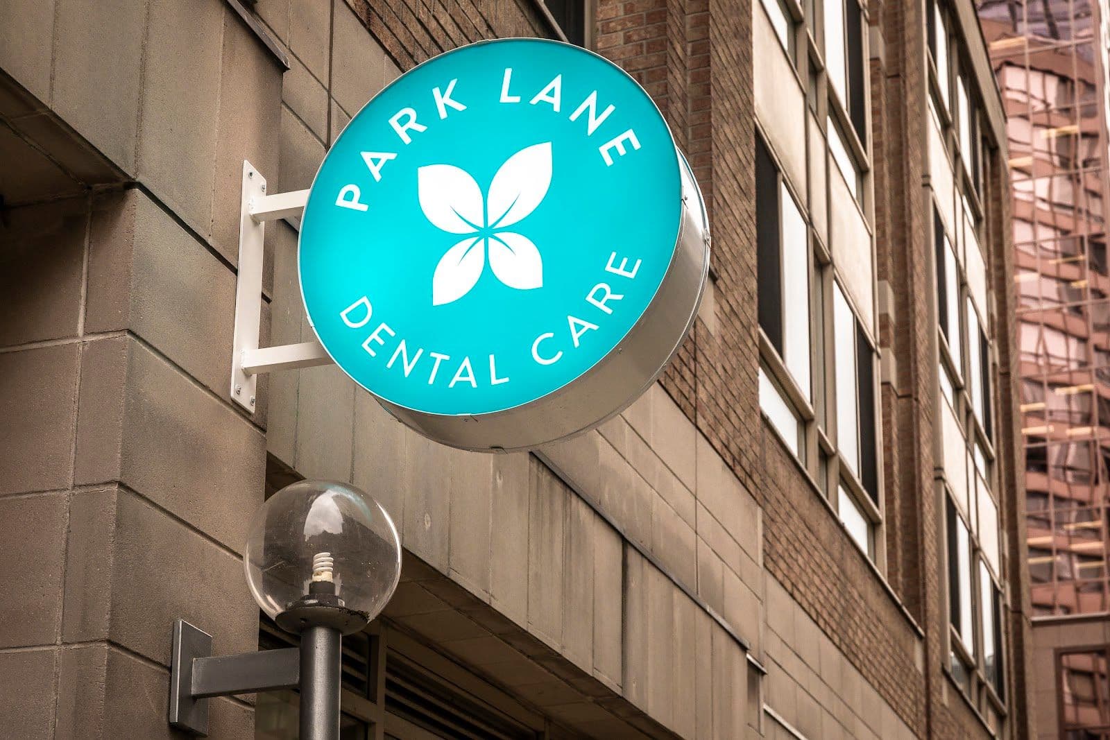 Park Lane Dental Care team reviewing patient feedback and Google reviews together at the front desk