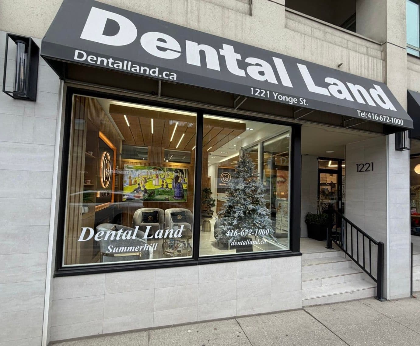 Dental Land Summerhill dental team reviewing patient feedback together at the front desk of their clinic