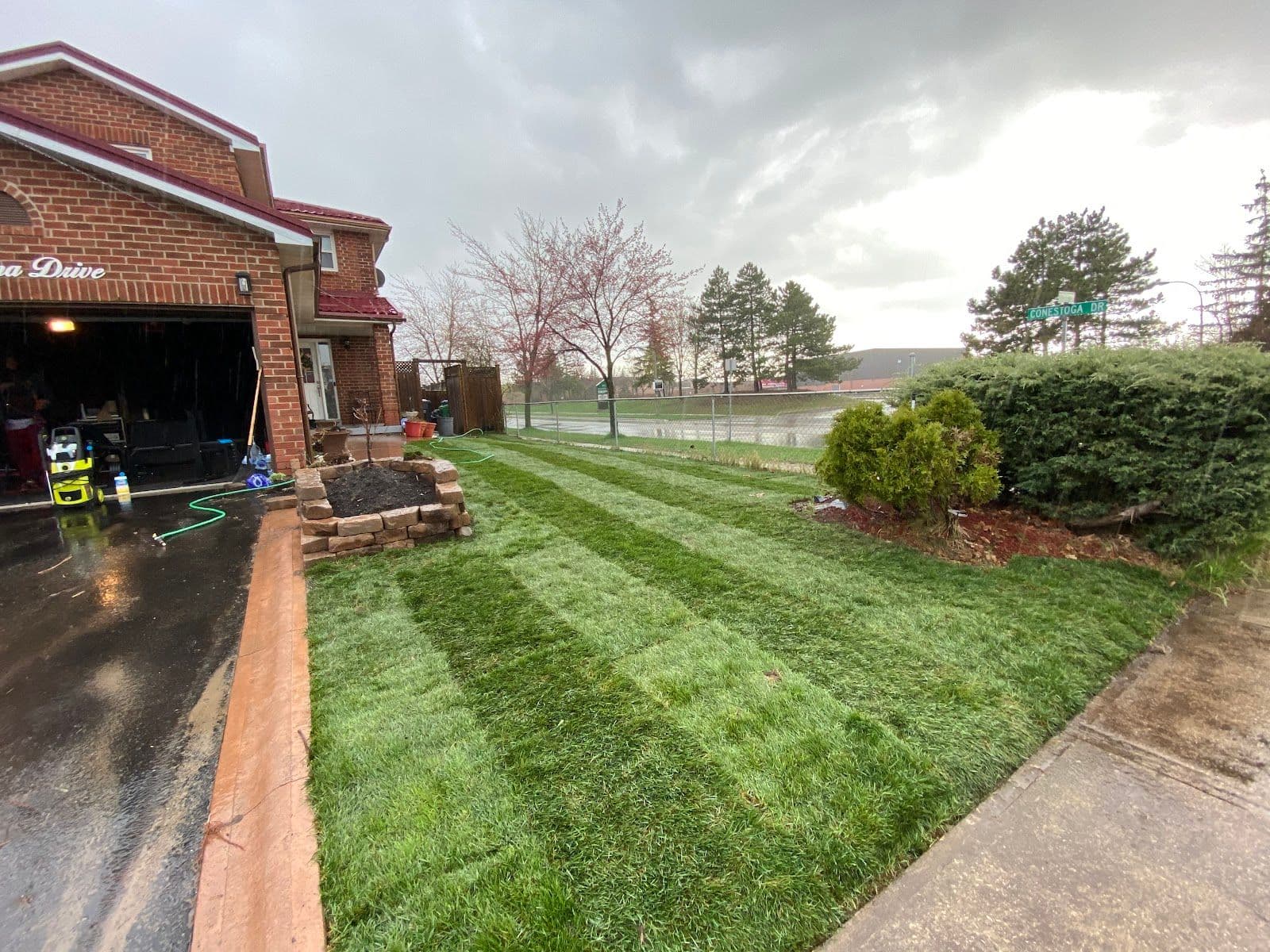 Green Yard Landscaping & Snow Removal owner reviewing customer feedback and Google reviews on a dashboard after a job