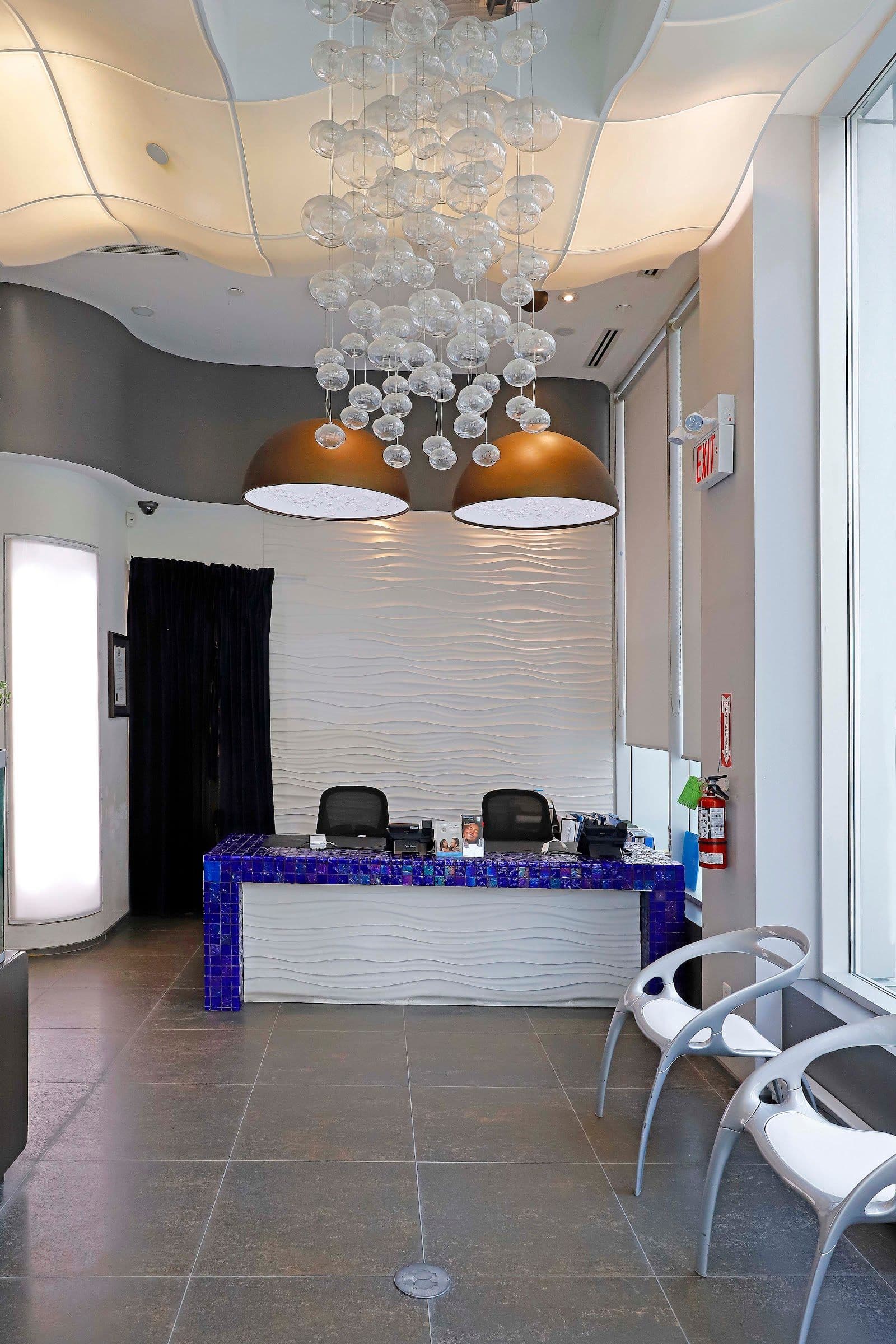 The Richmond Dental Centre team reviewing patient feedback together at the front desk