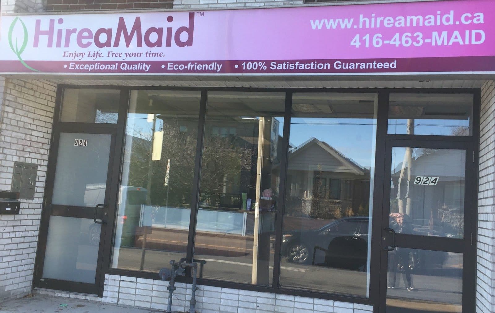 Hire A Maid House Cleaning Services of Toronto owner reviewing guest feedback and Google reviews on a tablet after a cleaning visit